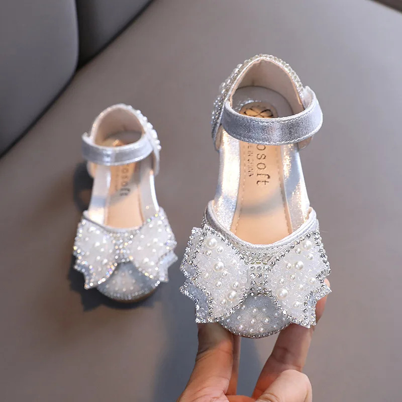 ฤดูร้อนสาวแบนรองเท้าแตะเจ้าหญิงแฟชั่นเลื่อมโบว์ Rhinestone รองเท้าเด็กรองเท้าเด็กสำหรับงานแต่งงานรองเท้าแตะ E618 ราคา  421 บาท*ส่งฟรี