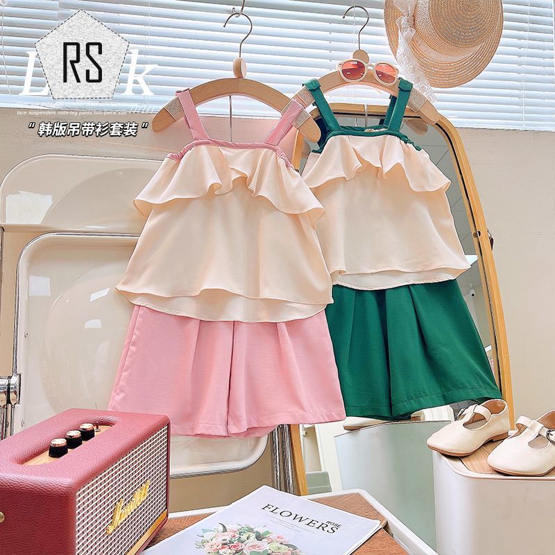 REALSELF เสื้อผ้าเด็กผญ ชุดแฟชั่นเด็กผู้หญิง การออกแบบแฟชั่น 2024 ใหม่สาวแฟชั่นสบาย ๆ หวานหลวมกระโปรงสายเดี่ยว + กางเกงขากว้าง 24725 ราคา 166 บาท*ส่งฟรี