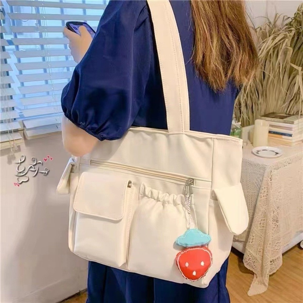 HERWK Màu sắc đồng nhất Túi Tote Canvas Dung lượng lớn Nylon Túi đeo vai Nhật Bản Đơn giản Phong cách Hàn Quốc Túi học sinh Ngoài trời - 3