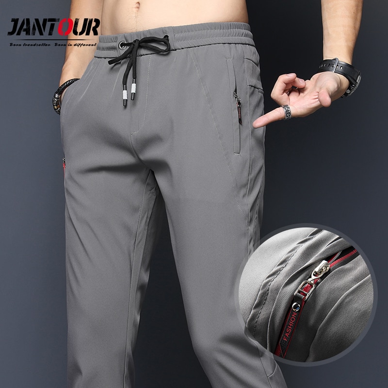 Quần nam đơn giản xuân hè ôm vừa Quần Chinos thời trang dây kéo mỏng eo co dãn Có Túi Quần khô nhanh nam quần áo nhãn hiệu