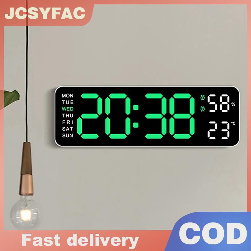 JCSYFAC นาฬิกาติดผนังดิจิตอลขนาดใหญ่แสดงอุณหภูมิและความชื้นเป็นสัปดาห์นาฬิกาปลุกตั้งโต๊ะ LED อิเล็กทรอนิกส์ปรับความสว่างได้ ราคา 201 บาท*ส่งฟรี