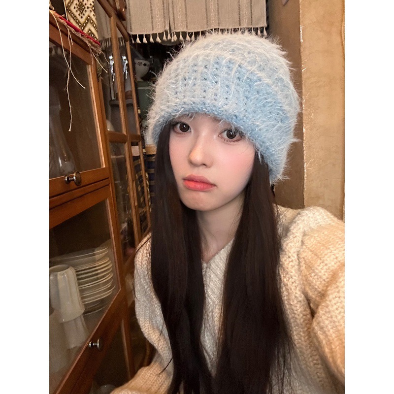 Knitted children autumn large head wrapped around pile of warmth and ear protection. Plush knitted hats for women in winter, with a cold headband trend