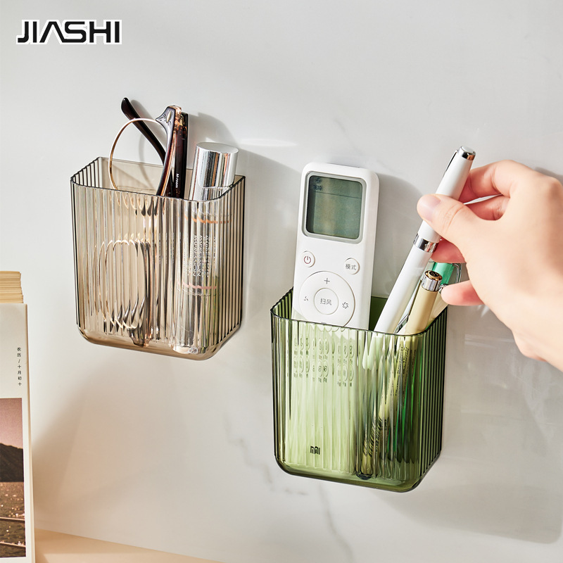 Remote control storage box wall-mounted bedside TV mobile phone punch-free wall-mounted transparent small storage rack ราคา 47 บาท*ส่งฟรี