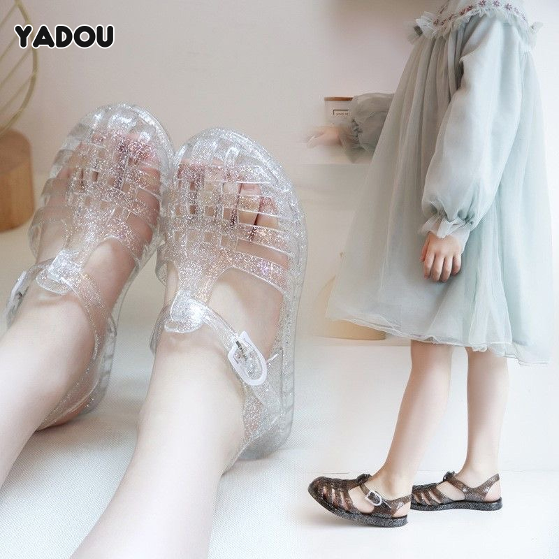 YADOU New Korean style girls princess shoes simple plastic sandals children's glass shoes primary school sandals Jelly sandals ราคา 90 บาท*ส่งฟรี