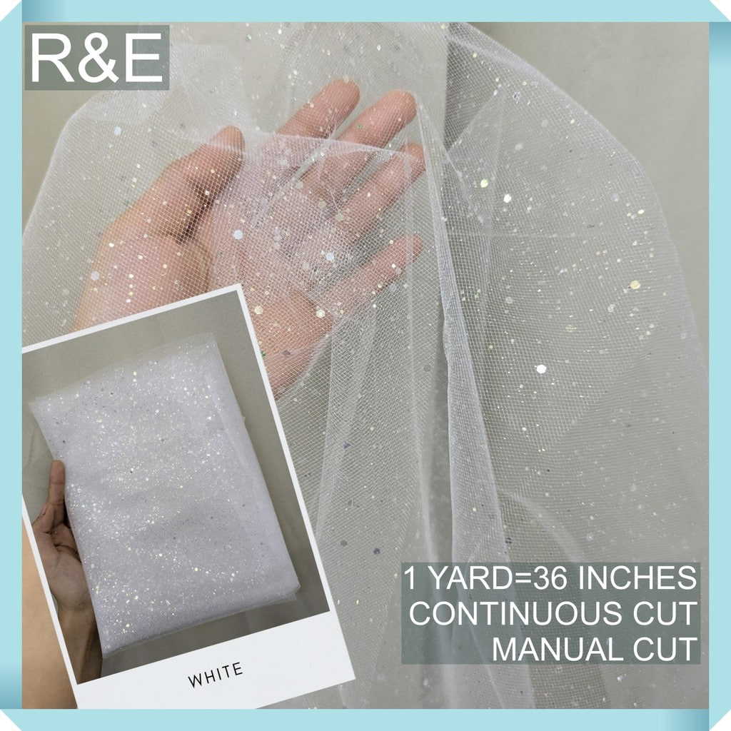 SILENKA GLITTERED FABRIC WITH FALLING GLITTERS TULLE PER YARD IS 36 INCHES LENGTH AND 60 FIXED WIDTH