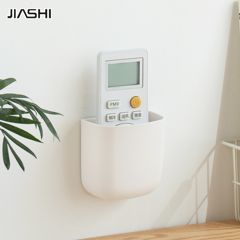 Home daily remote control plastic storage box wholesale wall mounted mobile phone charging stand storage rack ราคา 56 บาท*ส่งฟรี
