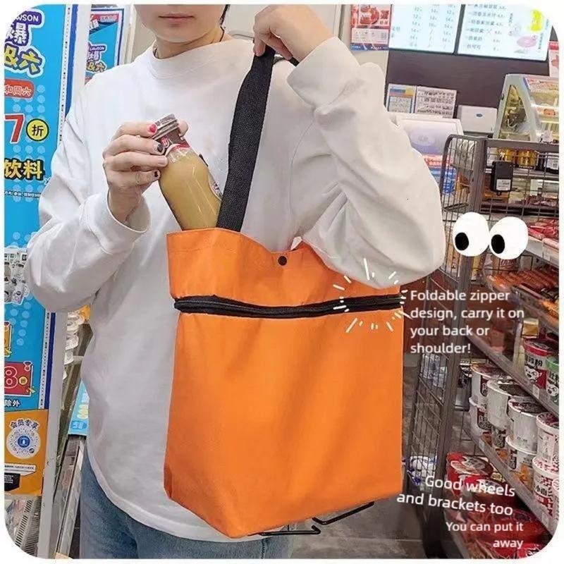 Nhiều mục đích Bánh xe lăn Túi gia cố Vải Oxford thiết kế có thể gập lại Ergonomic Grip cho vận chuyển vật nặng
