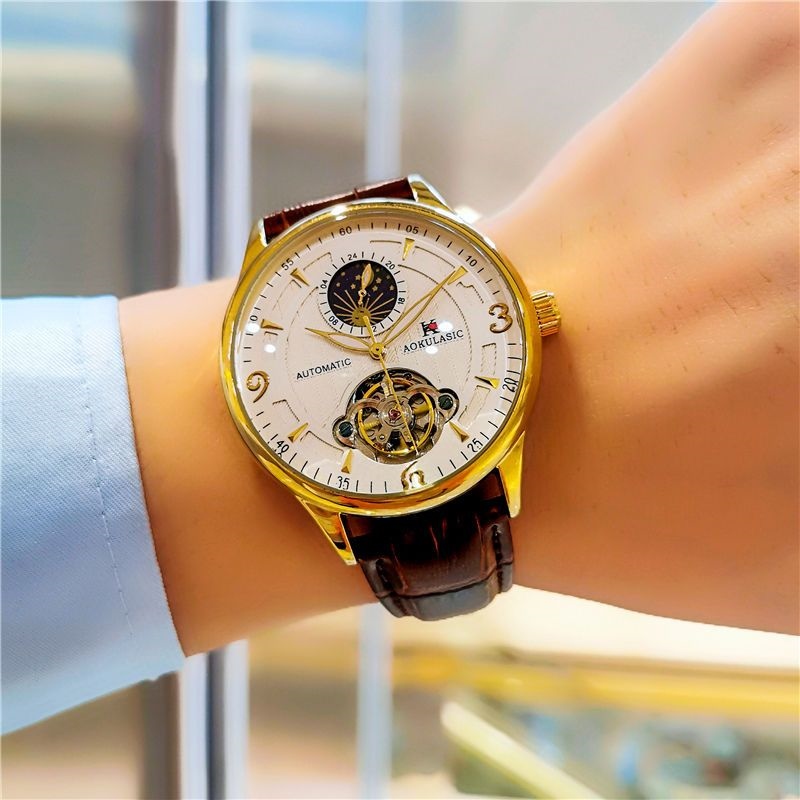 Thương hiệu Thụy Sĩ tự động Đồng hồ cơ không thấm nước Dạ Quang Nam Tourbillon chạm khoét Đồng hồ nam kinh doanh bảng thủy triều