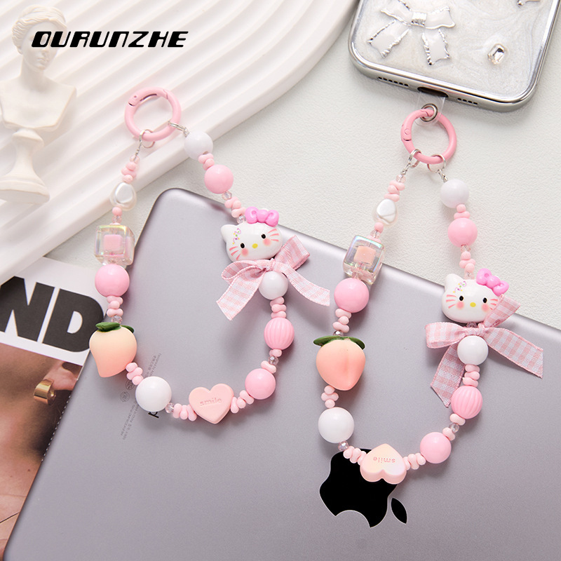 OURUNZHE สายโทรศัพท์น่ารักลายคิตตี้แคท ประดับผล đàoและโบว์ สร้อยคอแบบหวานสไตล์เกาหลีสำหรับกระเป๋าหรือข้อมือ ราคา 43 บาท*ส่งฟรี