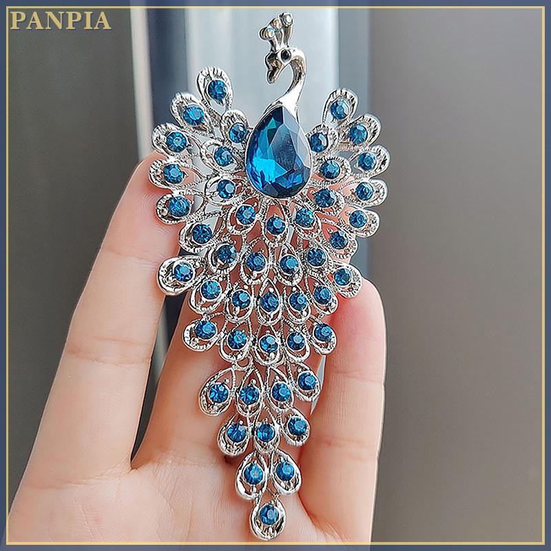[PANPIA] เข็มกลัดแฟชั่นรูปนกยูงประดับพลอยเทียมสำหรับผู้หญิงเสื้อผ้าสำหรับงานแต่งงานเครื่องประดับสำหรับงานเลี้ยงของขวัญ ราคา 39 บาท*ส่งฟรี