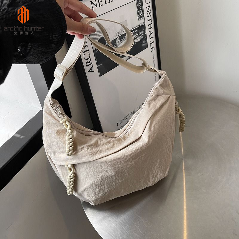 ARCTIC HUNTER túi đưa thư đeo vai thời trang Nhật bản đi lại dung tích lớn đa năng Tote nách túi xách cột đầu hình há cảo
