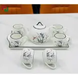 Bộ ấm chén gốm sứ vẽ họa tiết gồm hai dáng trụ và tròn