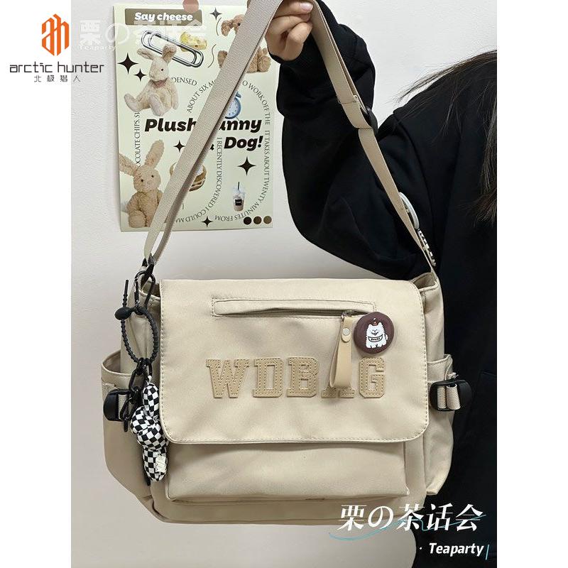  ARCTIC HUNTER Nhật Bản Phong Cách Hồng Kông bảo hộ lao động Túi Messenger cổ điển nam nhãn hiệu thời trang túi đeo chéo công suất lớn đi học cho sinh viên túi đeo vai phụ nữ 