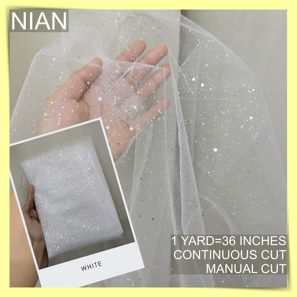 SILENKA GLITTERED FABRIC TULLE WITH FALLING GLITTERS PER YARD IS 36 INCHES LENGTH AND 60 FIXED WIDTH