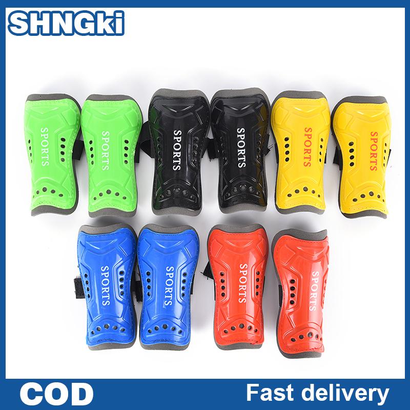 SHNGki สนับหน้าแข้งฟุตบอลแบบนิ่มสำหรับเด็ก1คู่อุปกรณ์ป้องกันผิวหนังบริเวณขาสำหรับเล่นกีฬา ราคา 36 บาท*ส่งฟรี