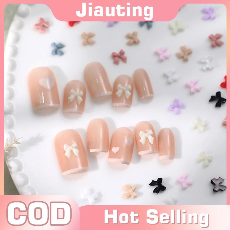 Jiauting 50pcs Bow resin Nail Art trang trí 3D kem màu Bowknot Nail Charm trang trí đồ trang sức DIY Làm Móng Tay Phụ KiệN Cổ điển