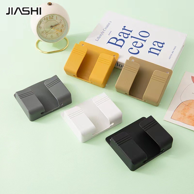 Punch-free mobile phone holder remote control storage box bedroom bedside mobile phone charging box multi-function wall-mounted storage rack ราคา 18 บาท*ส่งฟรี