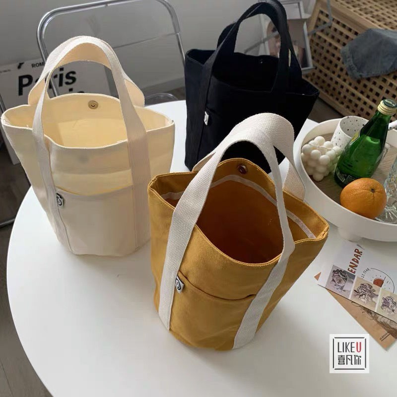 New Japanese bucket-shaped hand canvas bag minimalistic wild literary small capacity, lunch box, small bag men and women