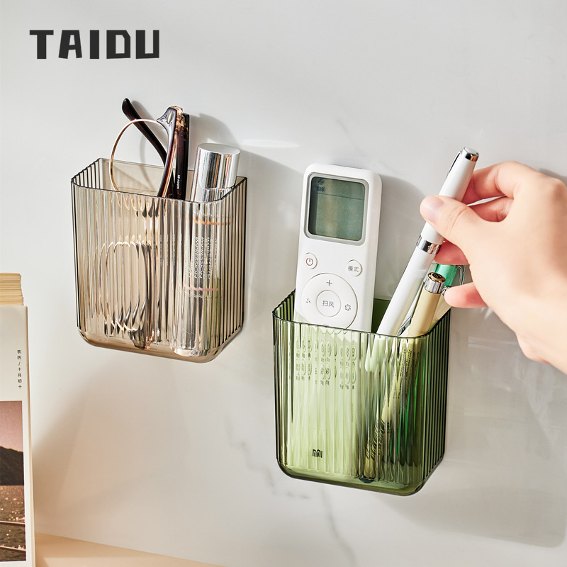 Remote control storage box wall-mounted bedside TV mobile phone punch-free wall-mounted transparent small storage rack ราคา 47 บาท*ส่งฟรี