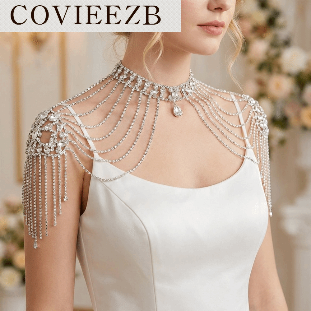 COVIEEZB การออกแบบที่หรูหรา สร้อยคอประดับเพชรเทียมสำหรับไหล่ สง่างาม สร้อยคอทอง/เงิน สร้อยคอประดับไหล่ ทันสมัย มีพู่หลายชั้น สร้อยคอพู่สำหรับเจ้าสาว พิธีแต่งงาน ราคา 1,157 บาท*ส่งฟรี