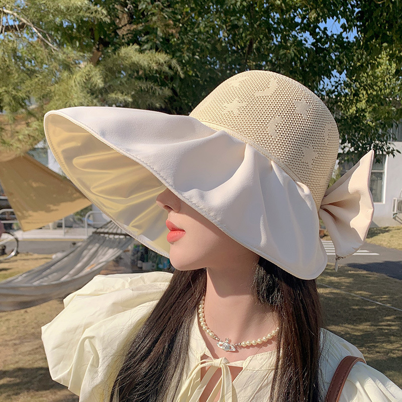 หมวกชาวประมงติดโบว์สีดำหมวกกันแดดแบบพับได้สำหรับผู้หญิงในช่วงฤดูร้อนหมวกกันแดดป้องกันรังสียูวีกลวงระบายอากาศ ราคา  696 บาท*ส่งฟรี